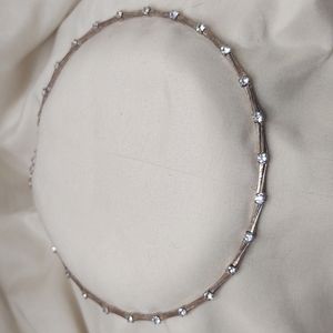 Rose gold and rhinestone chocker.